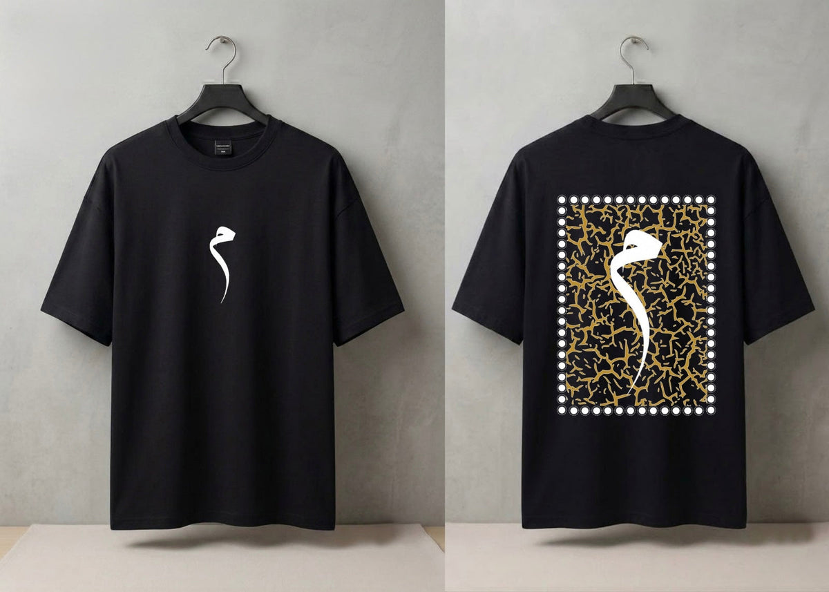 A black short-sleeve t-shirt shown from both front and back on hangers against a light gray wall. The front has a small white curved graphic on the left chest, and the back features a large square graphic with a white bird silhouette over a gold crackle pattern bordered by white dots.