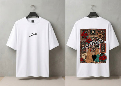 A white short-sleeve T-shirt shown from both front and back on black hangers against a gray wall. The front has a small black Arabic calligraphy graphic on the left chest.
